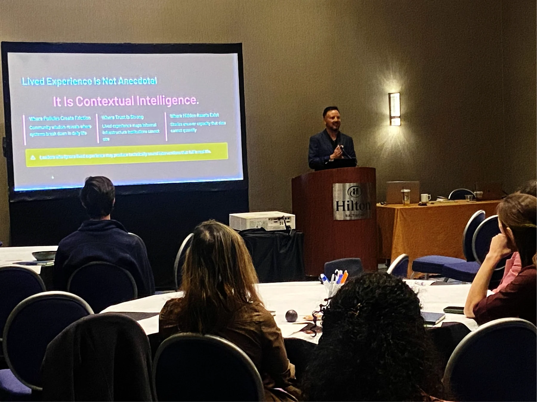 Gerold Delgado Dermid presenting on lived experience and contextual intelligence at Preventive Medicine 2026