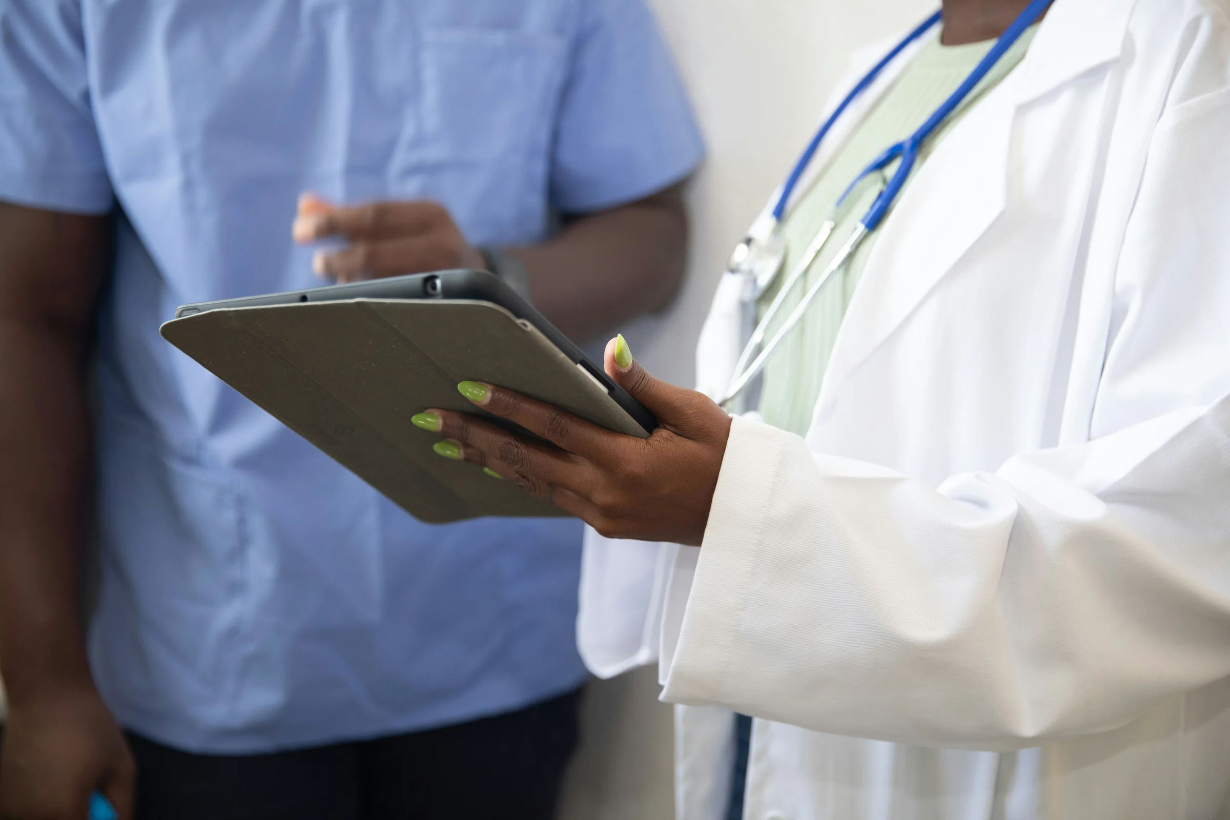 Physician and nurse reviewing a chart together