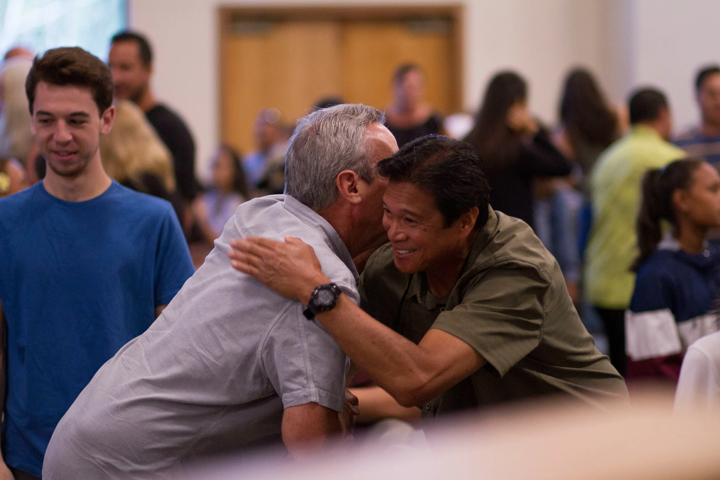 Neighbors greeting at a community gathering